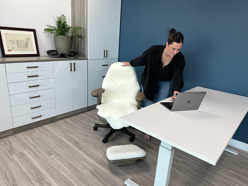 Person sitting comfortably in a LIFEFORM ergonomic chair at a modern workstation